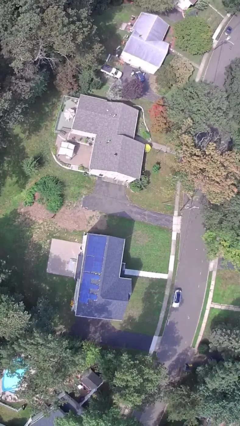 Aerial view of REC 405W black solar panels on an East Brunswick NJ residential roof